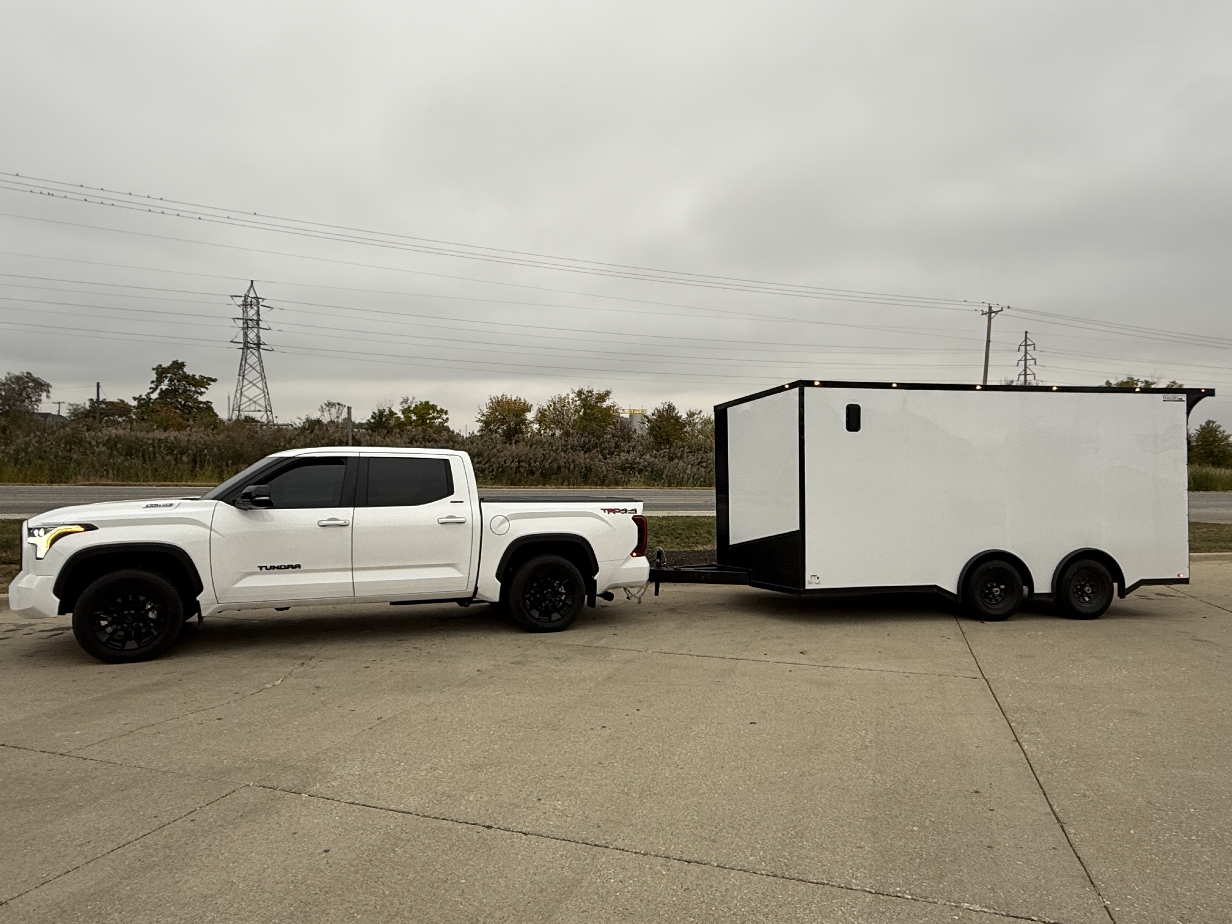 Enclosed trailer being towed by truck
