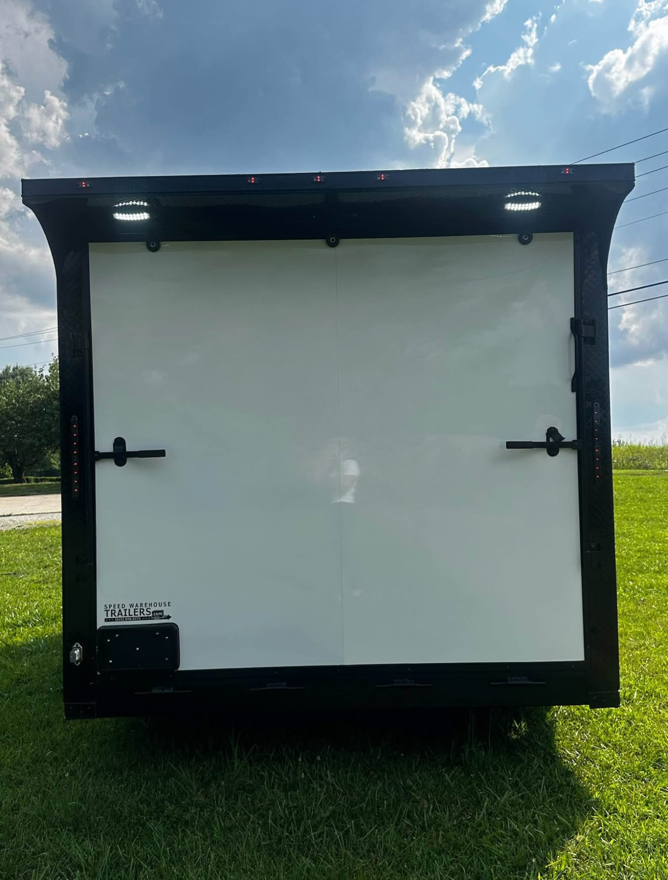 Enclosed trailer with ramp open