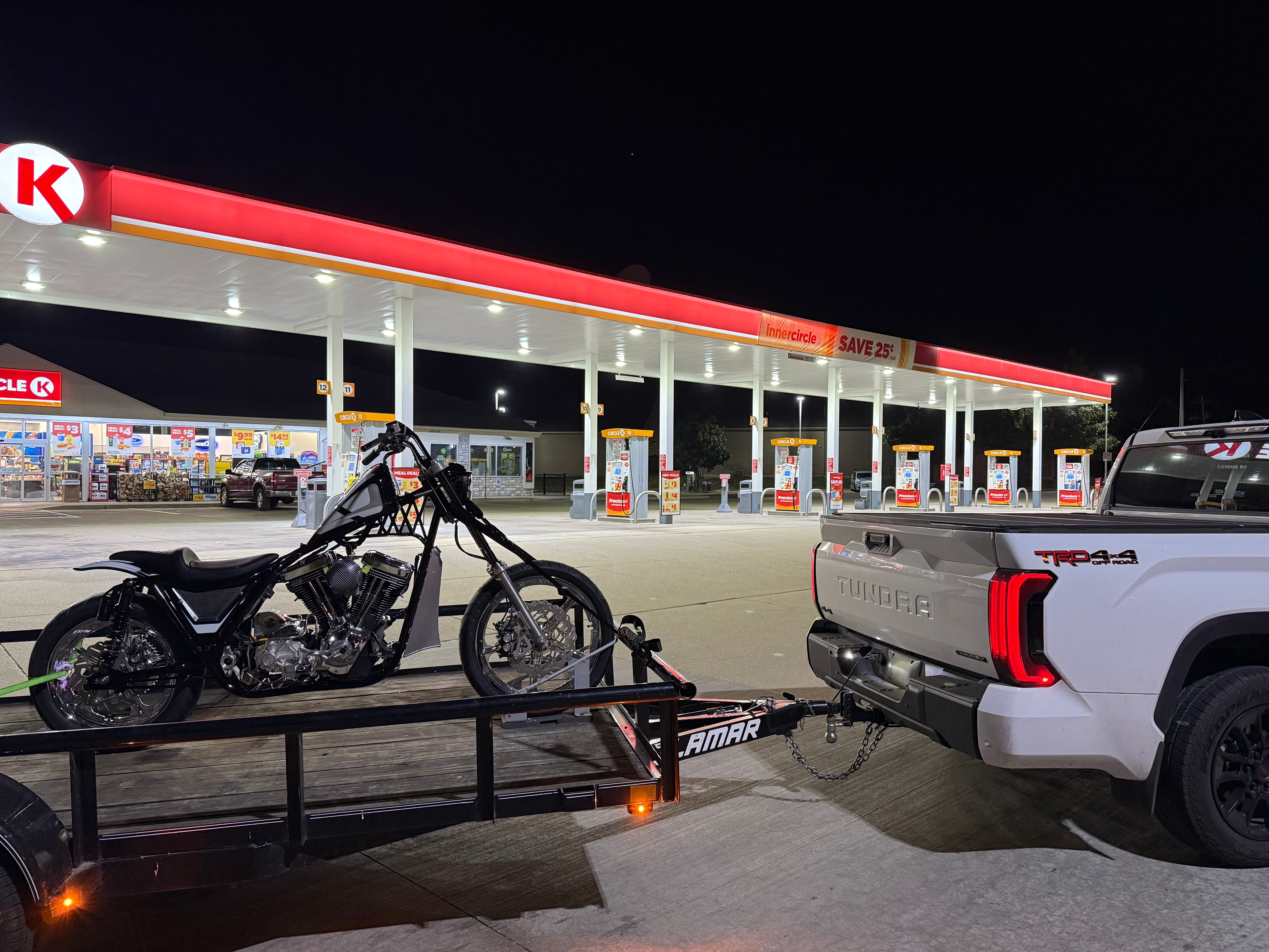 Utility trailer at night with motorcycle